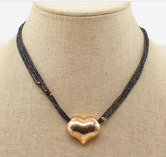 The black cords with gold heart necklace
